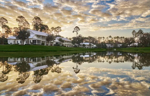 Guest Houses overlooking water with clouds above