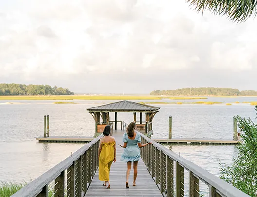 Women walking down dock