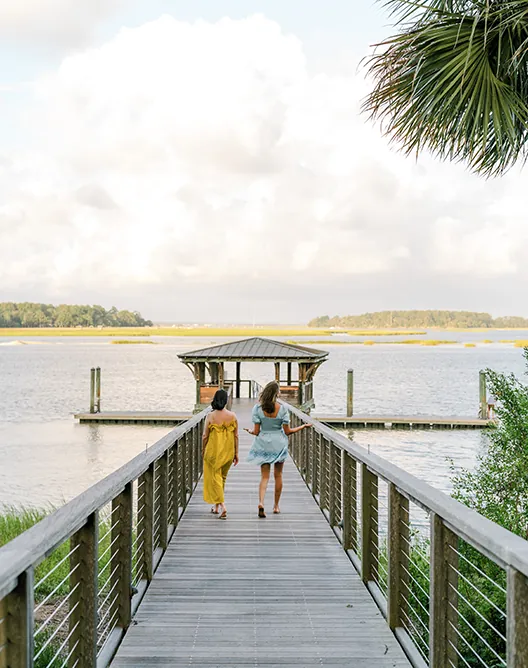 Women walking down dock