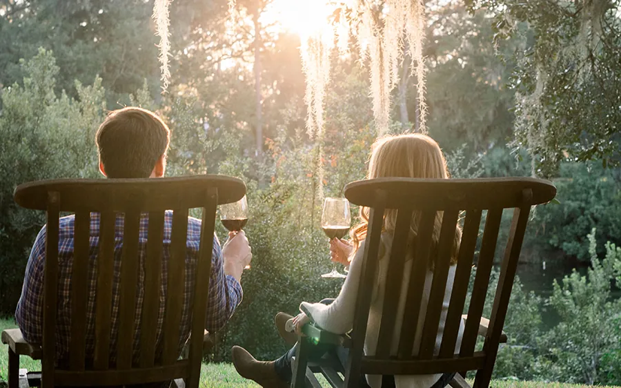 Couple in Chairs Drinking Wine