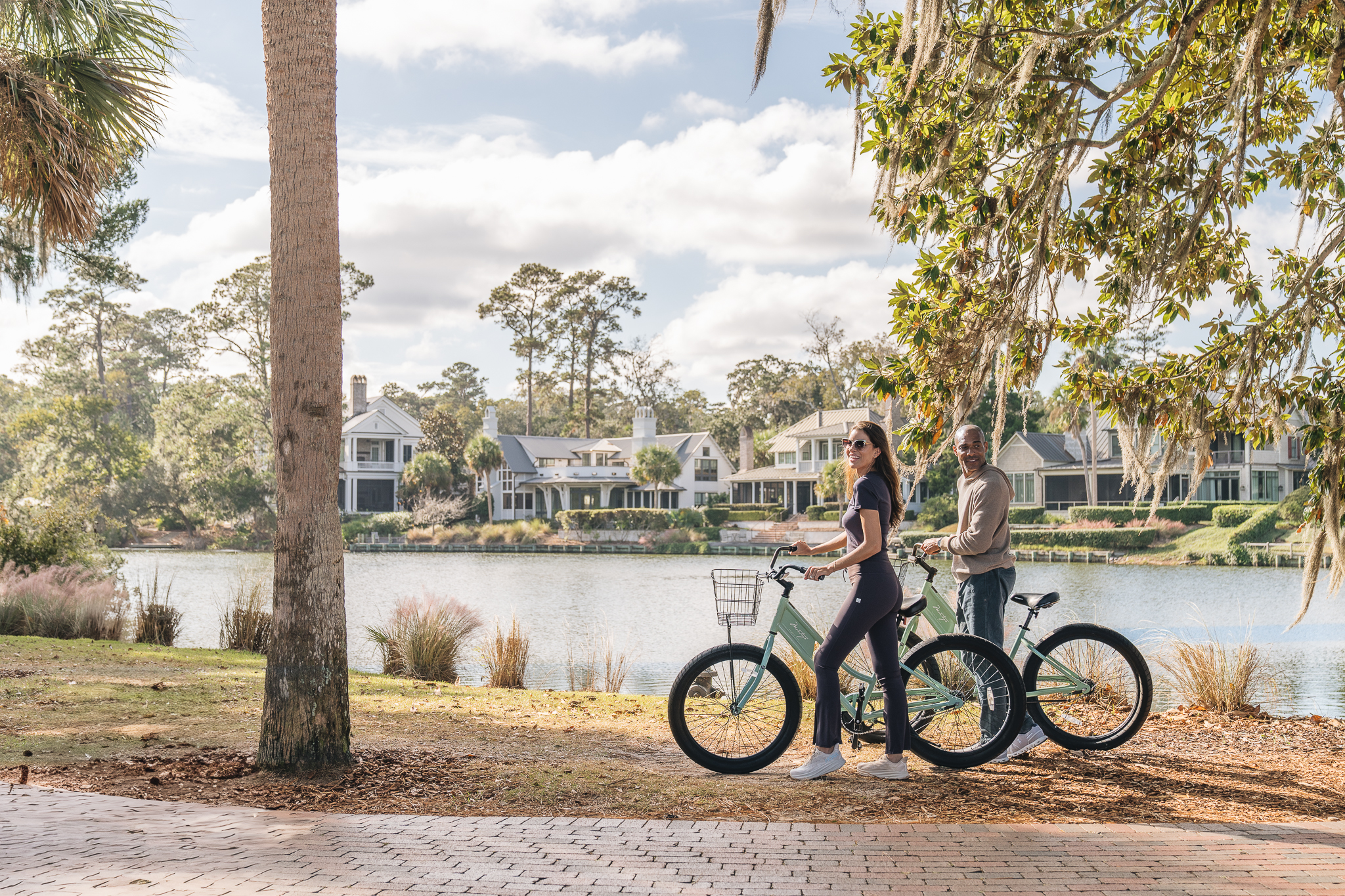 Couple biking in Wilson Village