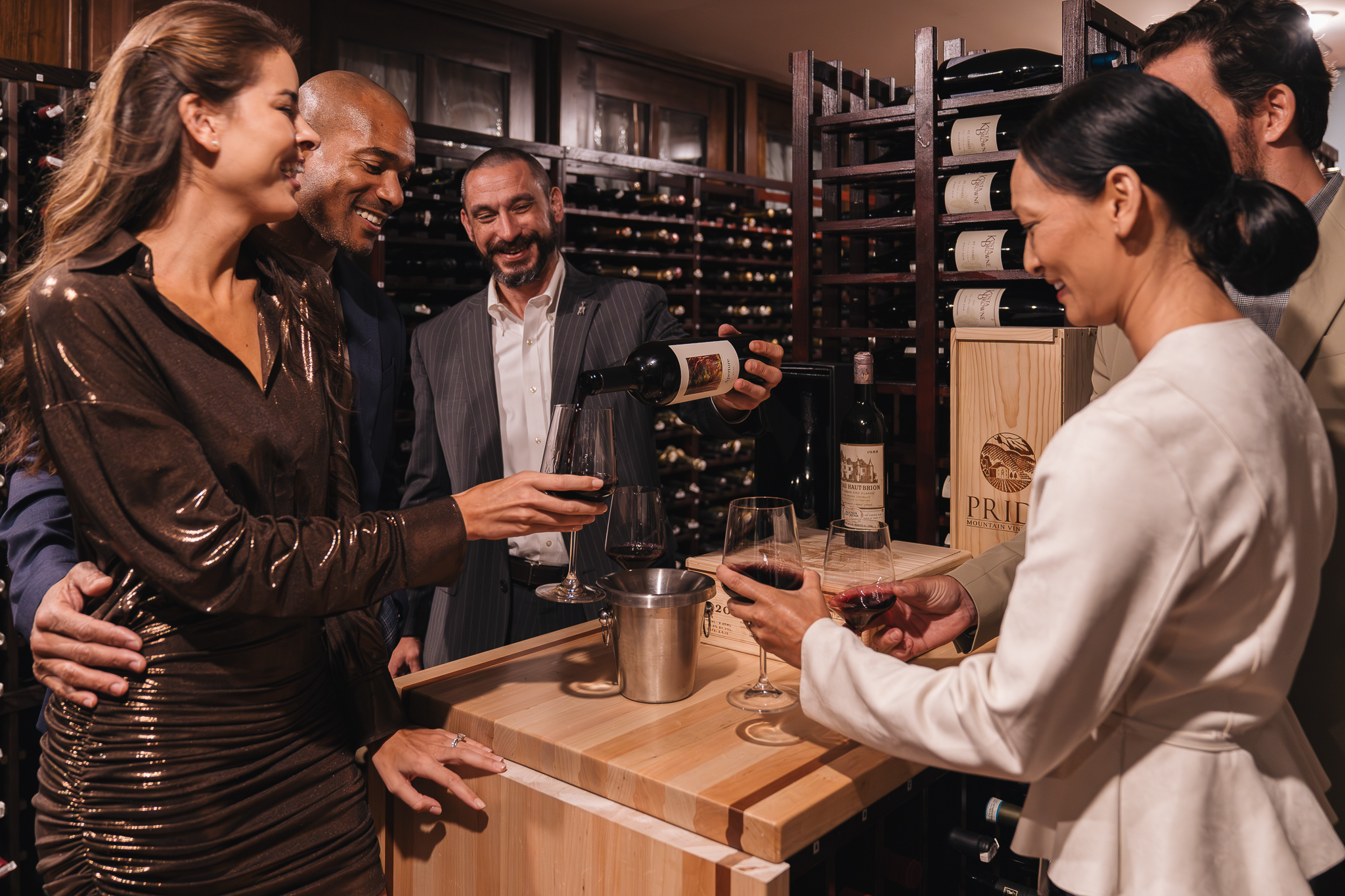 Couples enjoying a wine tasting in the cellar at Hush