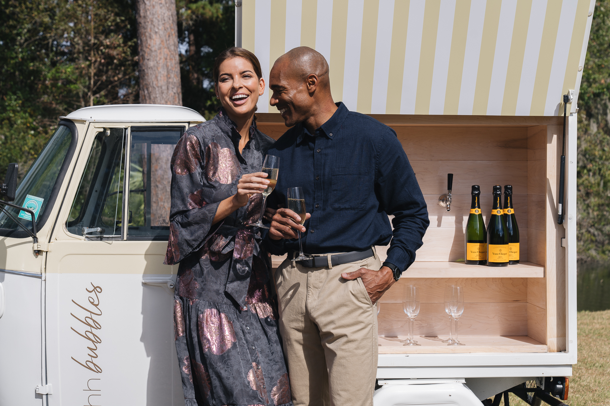 Couple enjoying champagne and oysters at Ohh Bubbles cart