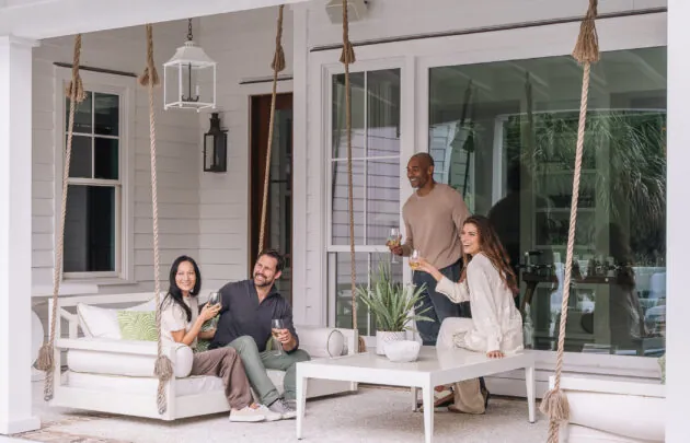 Couples gathered on porch swings