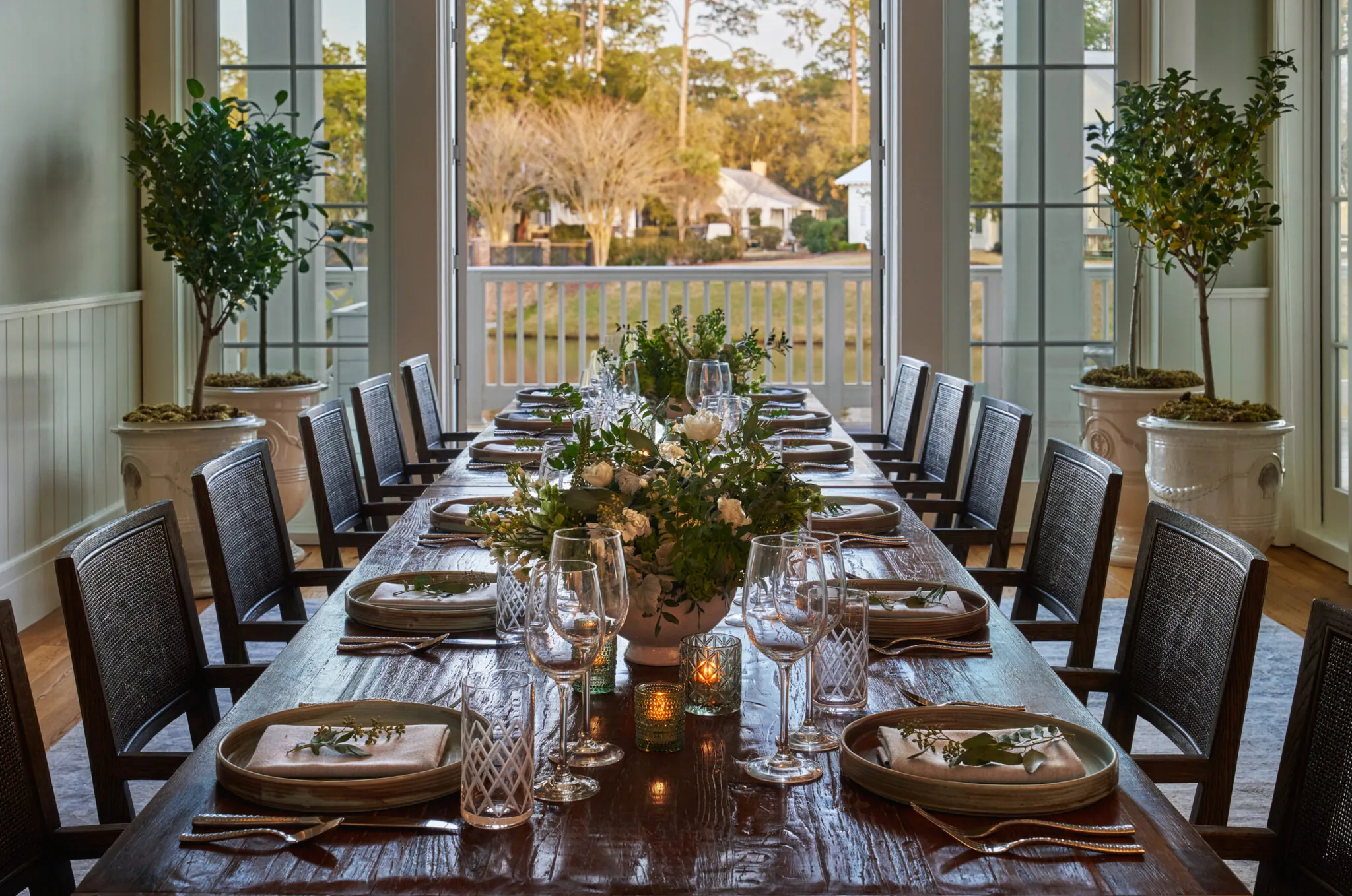 Long dining table at Octagon opening up to patio