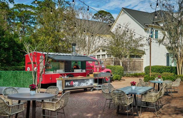 Tables outdoor in front of FLAME pizza