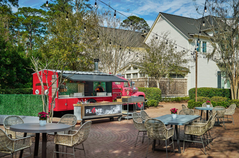Tables outdoor in front of FLAME pizza