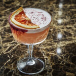 A pink cocktail at Hush on the Bluff