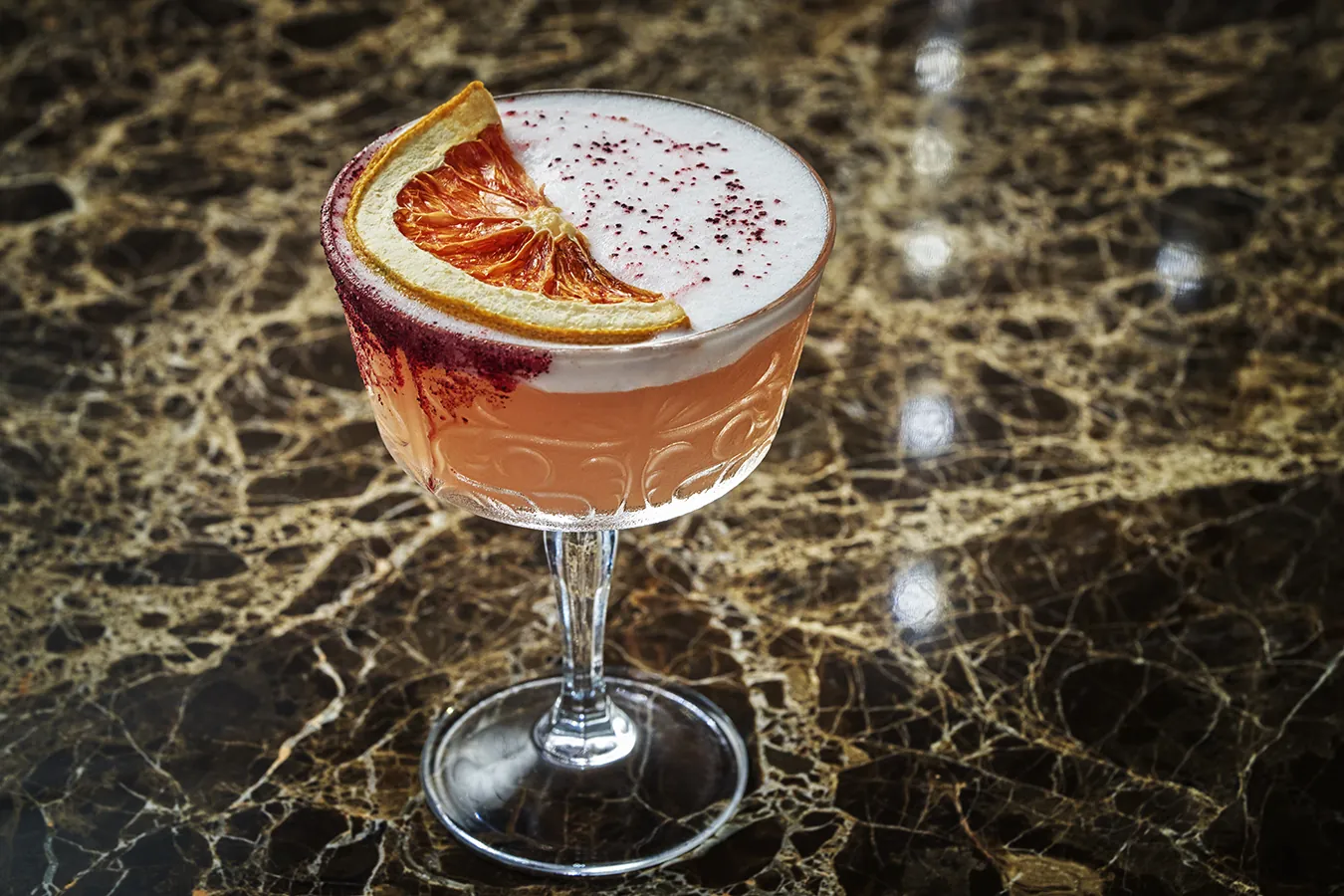 A pink cocktail at Hush on the Bluff