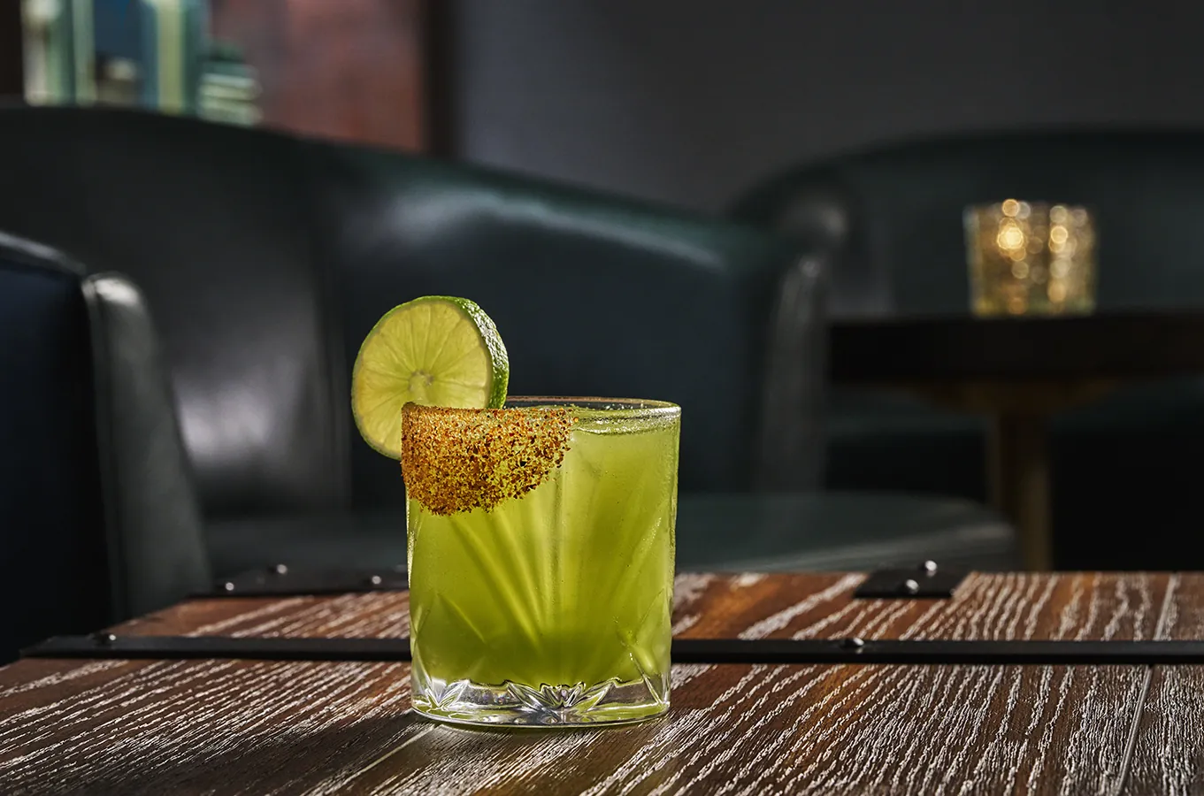 A green cocktail at Hush on the Bluff