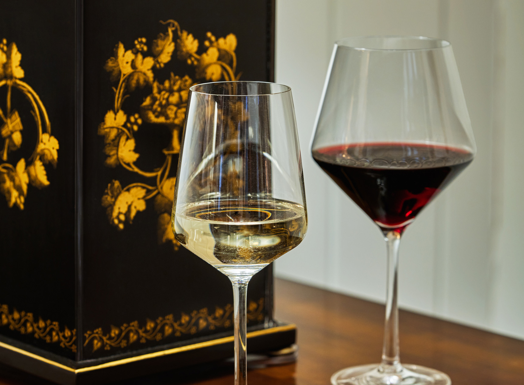 Two glasses of with on a wooden table