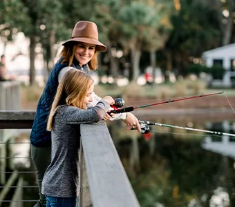 A mother and daughter fishing at Montage Palmetto Bluff